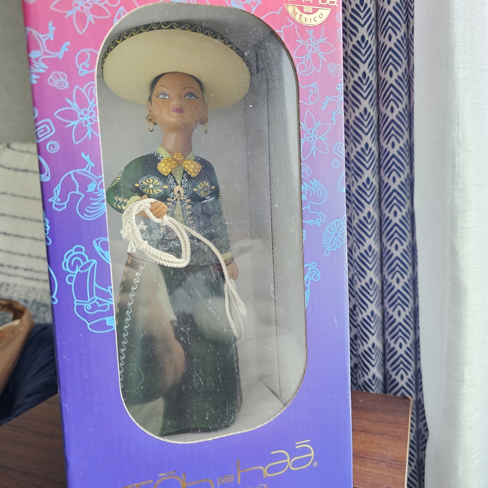 Elegant Green Figurine with Hat